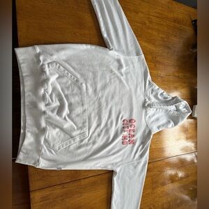 Ocean city hoodie with writing on the front and a design on the back!